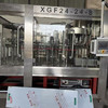 轉(zhuǎn)讓99成新38口24頭三合一飲料灌裝機(jī)，帶瀑布上蓋，風(fēng)送，附件齊全